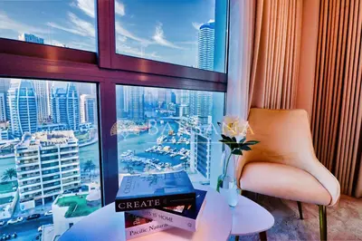 a room with a view of a city from a window at Barsana - Premier 3Bed Suite - Marina & Sea Views in Dubai