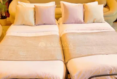 two beds sitting next to each other with pillows at Barsana - Premier 3Bed Suite - Marina & Sea Views in Dubai