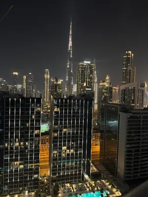 a view of a city skyline at night at Apartment Downtown Dubai in Dubai
