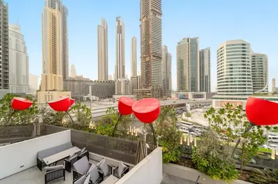 a view of the city from the rooftop of a building at FIRST CLASS 2BR Pool View and near Dubai Mall in Dubai