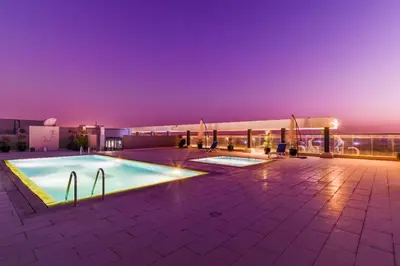a swimming pool on the roof of a building at The Executive Nest -1BR in Dubai in Dubai