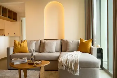 a living room with a couch and a table at Luxury Apt 2BR with full burj khalifa view in Dubai