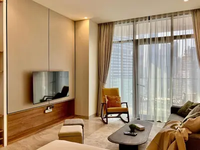 a living room with a couch and a tv at DAYF-PENZOR Upgraded Studio for 4 with Full Burj View in Dubai
