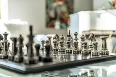 a close up of a chess set on a table at DAYF-NIL Lux 5-BR Villa with Pool & Piano - Green Community in Dubai