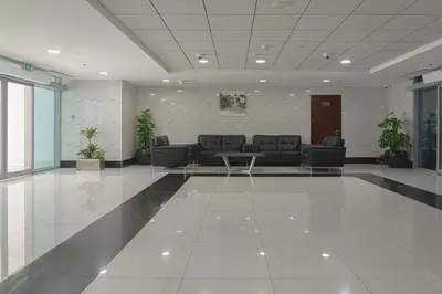a lobby with a couch and a table in a building at Modern 2BR Apartment at JBR in Dubai
