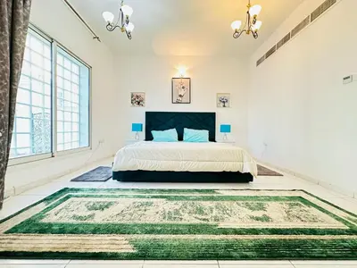 a bedroom with a bed and a large rug at Dubai Al Barsha Villa Fully Furnished Luxury Private Master Room Ensuite Huge Space Deluxe in Dubai