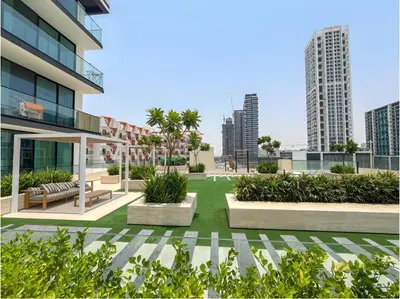 a courtyard in a building with benches and plants at 2 Bed, Private Pool, Big Terrace, Solysian Stay in Dubai