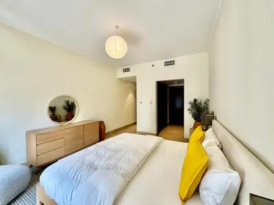 a bedroom with a bed and a mirror on the wall at Only family Walking distance to Dubai Mall in Dubai