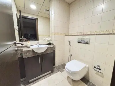 a bathroom with a toilet and a sink at Premium 1BR in Dubai Marina King Bed, Marina View, Near JBR, Beach & Vibrant Nightlife in Dubai