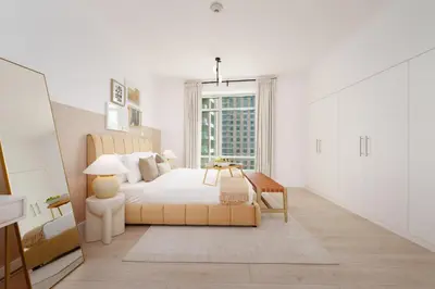 a white bedroom with a bed and a window at Burj Views East, Downtown - Mint Stay in Dubai