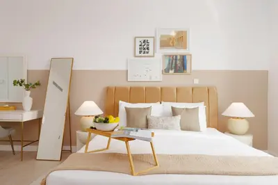 a bedroom with a bed and a table with a mirror at Burj Views East, Downtown - Mint Stay in Dubai