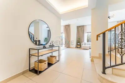 a bathroom with a sink and a mirror on the wall at Spacious 4BR Plus Maids Villa, Near Avenue Mall, Cycle Park & Sports Complex - 15 Mins to Downtown Dubai, Nad Al Shiba Third by Deluxe Holiday Homes in Dubai
