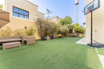 an image of a backyard with a basketball hoop at Spacious 4BR Plus Maids Villa, Near Avenue Mall, Cycle Park & Sports Complex - 15 Mins to Downtown Dubai, Nad Al Shiba Third by Deluxe Holiday Homes in Dubai