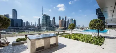a view of a city skyline with skyscrapers at Luxury 1BR with Pool, Gym Canal & Burj Khalifa view in Dubai