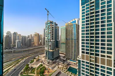 an aerial view of a city with tall buildings at Stylish Apartment with Pool, Gym and Skyline View Dubai Gate in Dubai