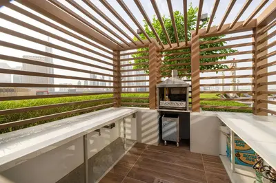 a kitchen with a pergola and a grill in a building at Vida Dubai Mall! Excellent Amenities! Direct Access To Dubai Mall in Dubai
