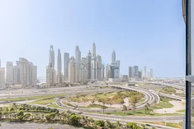 a view of the city of dubai from a skyscraper at Spacious 1BR Overlooking City Skyline and Marina, Next to JLT Lakefront, Just Minutes to Metro, Jumairah Bay Tower X1, JLT by Deluxe Holiday Homes in Dubai