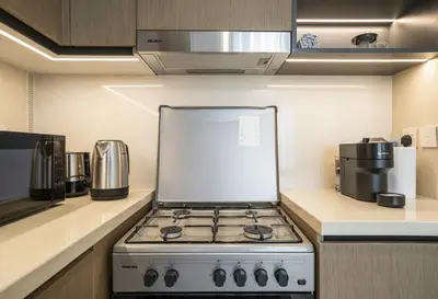 a kitchen with a stove top oven in a kitchen at A&S Properties Downtown Dubai in Dubai