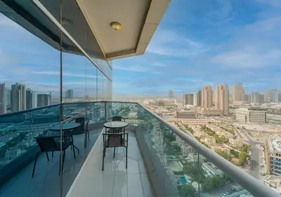 a view of the city from the top of a building at Lux JVT Resort Pools Spa Gym Kids Play in Dubai