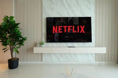 a living room with a television on a wall at KeyRock - Palm & Sea View Apt at Grand Bleu in Dubai