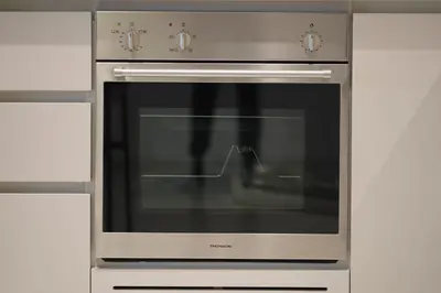 a stainless steel oven with its door open in a kitchen at KeyRock - 1BR with Sea & Palm Jumeirah Views in Dubai