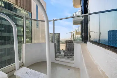 a balcony with a view of a city at ALiving Modern Studio I Private Pool I Opalz by Danube- 1308 in Dubai
