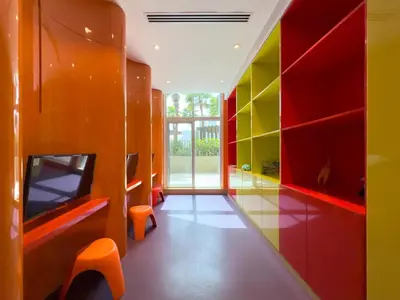 a room with brightly colored cabinets and a hallway at GuestReady - Canal View | Studio + Sofa Bed in Dubai