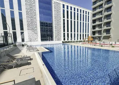 a swimming pool in the middle of a building at Bloomfields Stylish Stu Laya Heights in Dubai