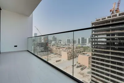 a balcony with a view of a city at TRPS - Binghatti Amber, JVC - Luxury 1BR Haven - Prime Location in Dubai