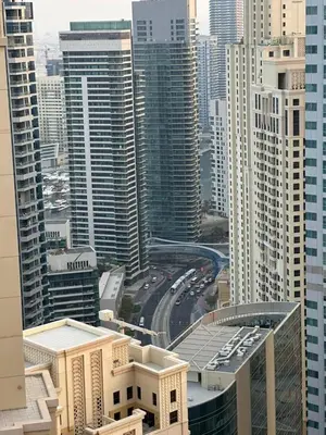 a view of a city with buildings and cars at JBR Skyview Rooms in Dubai