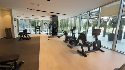 a gym with treadmills and exercise equipment in a building at Luxe 1 Bedroom with High Floor close to Dubai Mall in Dubai