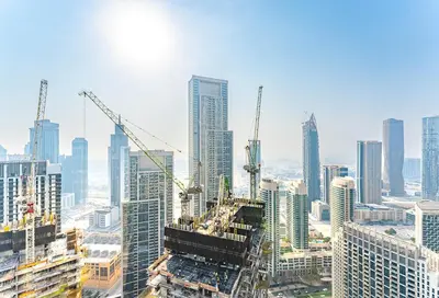 a view of a city with construction cranes at Luxe 1 Bedroom with High Floor close to Dubai Mall in Dubai