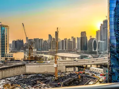 a view of a city with a construction site at Luxury 2BR near Burj Khalifa with Rooftop Pool, City & Canal Views, Free Parking in Dubai