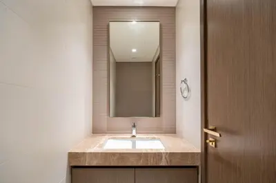 a bathroom with a sink and a mirror at Keyrock - Emaar Beachfront Apartment with Sea & Palm Jumeirah Views in Dubai
