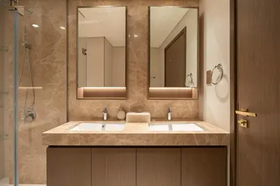 a bathroom with a sink and a mirror at KeyRock - Dreamy Stay with Palm View - Emaar Beach in Dubai