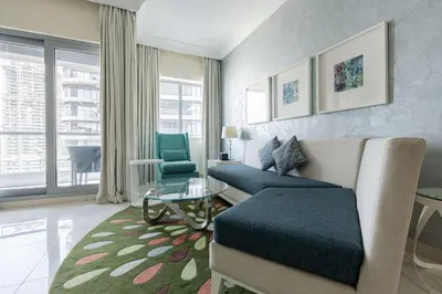 a living room with a couch and a table at TRPS - Maison Mall Street, Downtown - Close to Dubai Mall, Fully Furnished 1BR in Dubai
