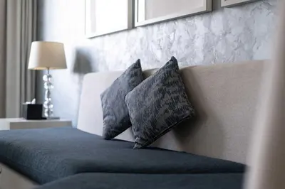a bedroom with a bed with two pillows on it at TRPS - Maison Mall Street, Downtown - Close to Dubai Mall, Fully Furnished 1BR in Dubai