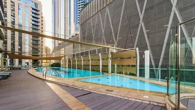a swimming pool on the side of a building at TRPS - Maison Mall Street, Downtown - Close to Dubai Mall, Fully Furnished 1BR in Dubai