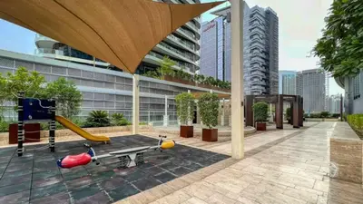 a building with a playground with a slide at TRPS - Maison Mall Street, Downtown - Beautifully Appointed 1BR, Near to Burj Khalifa in Dubai