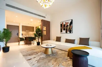 a living room with a couch and a table at KeyRock - Palm View Luxury Stay in Grand Bleu in Dubai