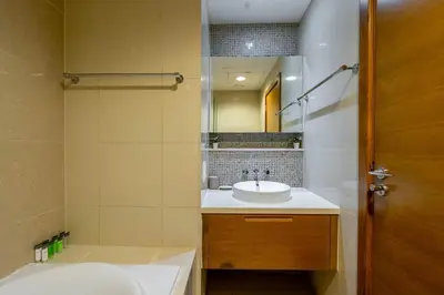 a bathroom with a sink and a mirror at DAYF-CLA Stylish Apartment for 4 Guests in Central Location in Dubai