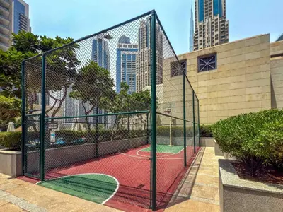a tennis court with a net in a city at DAYF-CLA Stylish Apartment for 4 Guests in Central Location in Dubai