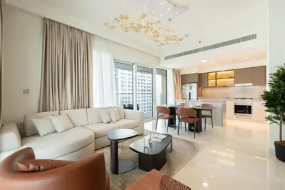 a living room with a couch and a table at KeyRock - Grand Bleu Escape with Iconic Palm Views in Dubai