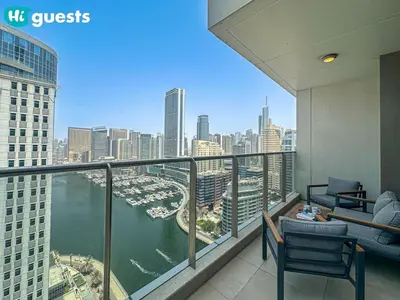a balcony of a building with a view of a harbor at HiGuests - Marina View 1 BR with Spacious Balcony in Dubai