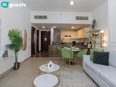 a living room with a couch and a table at HiGuests - Marina View 1 BR with Spacious Balcony in Dubai