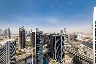 a view of a city with tall buildings at Studio Apartments with City View at DAMAC Maison Prive in Dubai