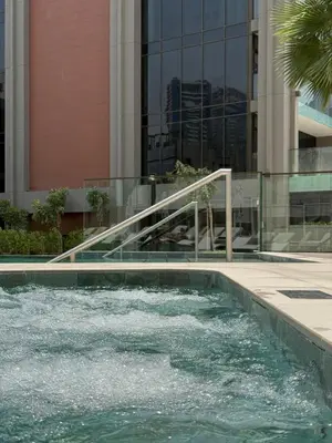 a swimming pool in front of a building at Hububb Luxury Peninsula 5 Dubai in Dubai