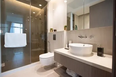 a bathroom with a sink and a toilet and a shower at Hububb Luxury Peninsula 5 Dubai in Dubai