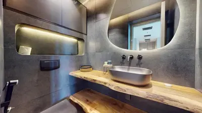 a bathroom with a sink and a mirror at Ocean Heights - Upgraded Two Bed with Sea View in Dubai