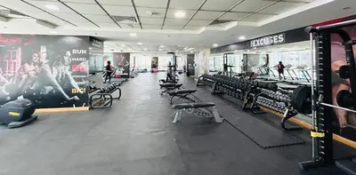 a gym with rows of treadmills and machines at Amazing 1BR High-floor with Breathtaking View near Marina Walk in Dubai